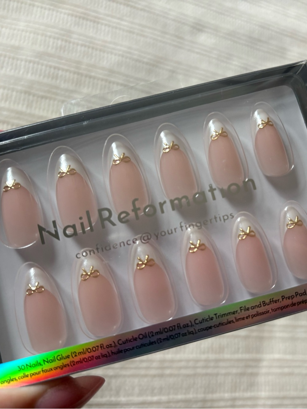 New Reformation Soft Nude Pink Press-On Nails with Gold Bow Accents
